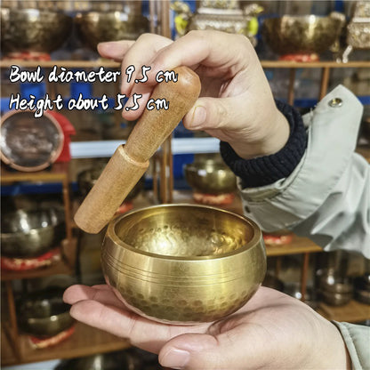 Tibetan brass singing bowl with Sanskrit – handmade meditation instrument for stress relief.