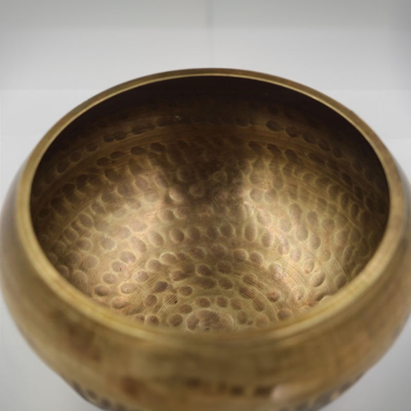 Tibetan brass singing bowl with Sanskrit – handmade meditation instrument for stress relief.