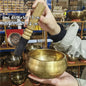 Tibetan brass singing bowl with Sanskrit – handmade meditation instrument for stress relief.